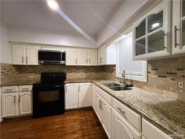 kitchen featuring electric range, sink, dark hardwood / wood-style floors, backsplash, and white cabinets