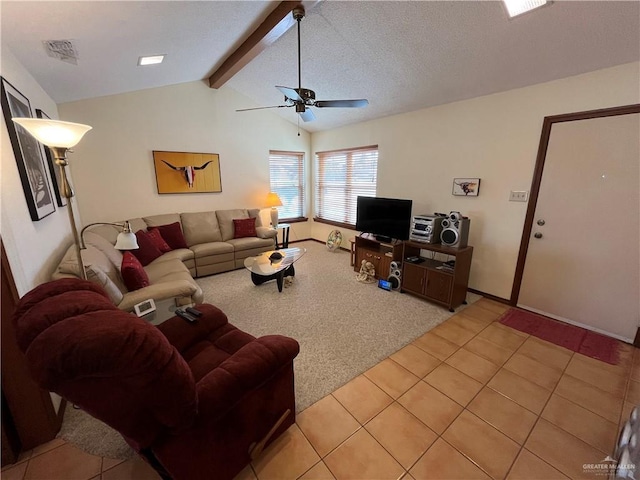 living area featuring vaulted ceiling with beams, ceiling fan, light tile patterned floors, light carpet, and visible vents