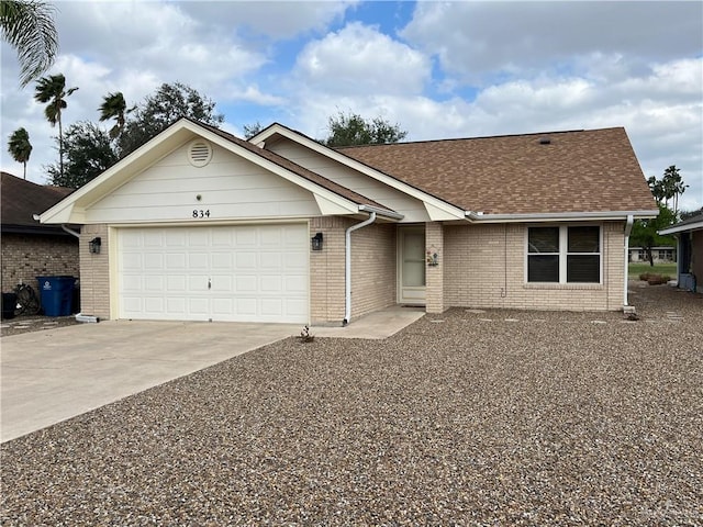 single story home with a garage, brick siding, driveway, and roof with shingles