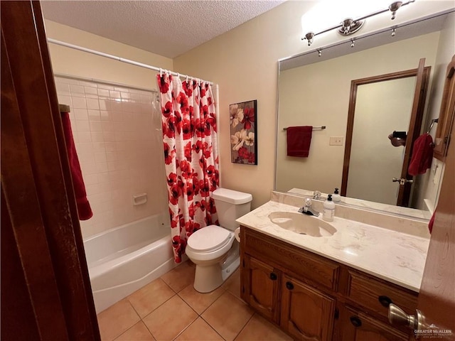 bathroom featuring shower / tub combo, toilet, tile patterned flooring, a textured ceiling, and vanity