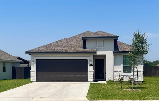 8507 N 33rd Ln N, Mcallen, TX 78504 - view of front of home featuring stone siding, a shingled roof, stucco siding, a garage, and driveway