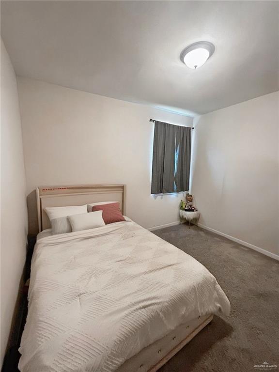 8507 N 33rd Ln N, Mcallen, TX 78504 - bedroom featuring carpet flooring and baseboards