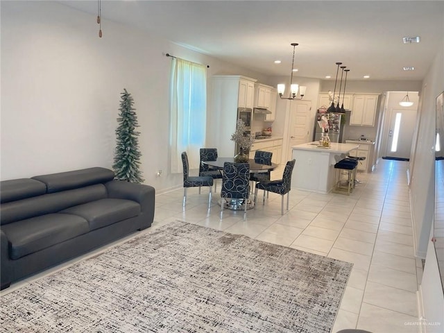 8507 N 33rd Ln N, Mcallen, TX 78504 - living room with light tile patterned flooring, a chandelier, recessed lighting, and baseboards