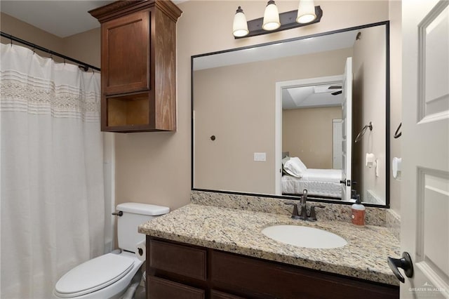 1200 E Pineridge Ave Unit 1, Mcallen, TX 78503 - ensuite bathroom with vanity, toilet, and curtained shower