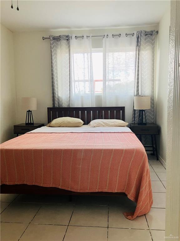 bedroom featuring tile patterned floors