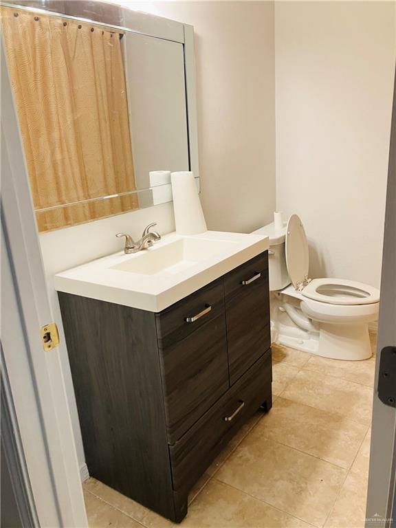 bathroom with vanity and toilet