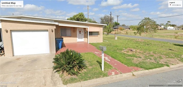 ranch-style home with a garage and a front lawn