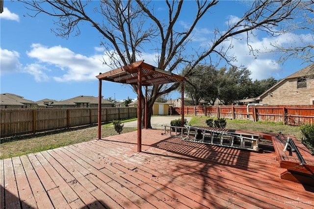 wooden terrace featuring a shed