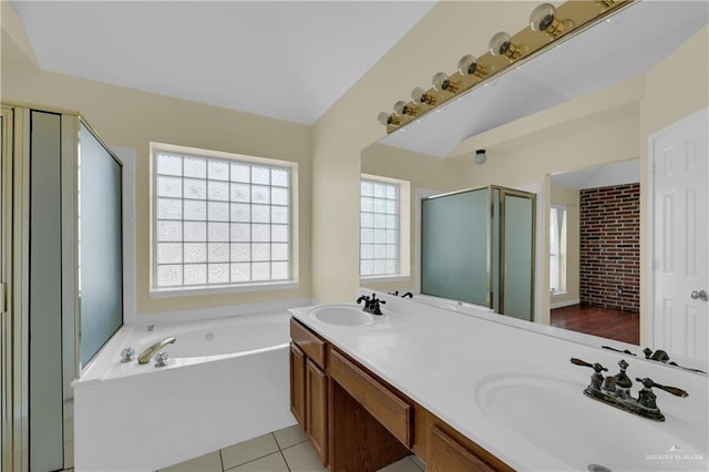 bathroom with independent shower and bath, tile patterned flooring, and vanity