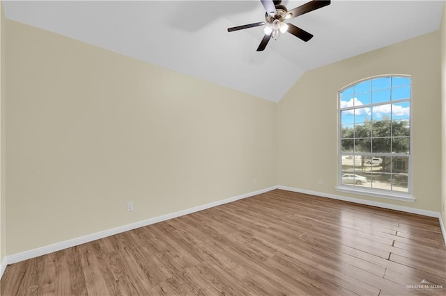 unfurnished room featuring light wood-type flooring, lofted ceiling, and ceiling fan