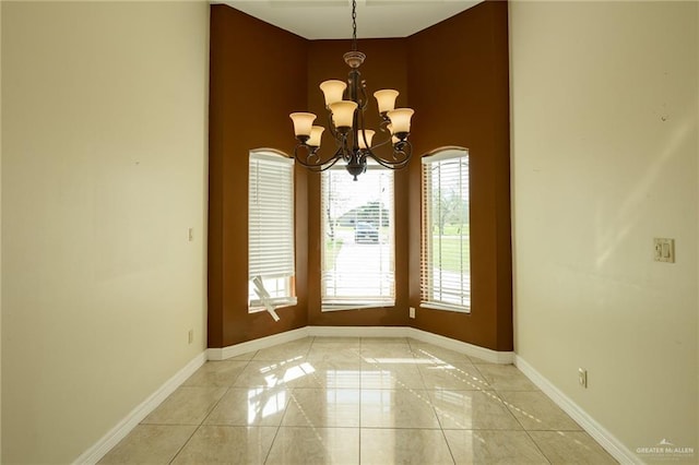 unfurnished dining area with a notable chandelier