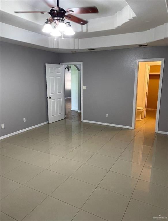 205 Msg Mario A Solis Ln, La Villa, TX 78562 - tiled spare room with a tray ceiling, ceiling fan, and arched walkways