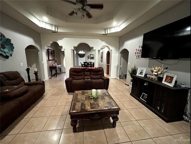 205 Msg Mario A Solis Ln, La Villa, TX 78562 - living area with arched walkways, ceiling fan, light tile patterned floors, and a raised ceiling