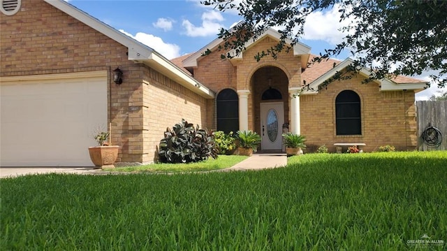205 Msg Mario A Solis Ln, La Villa, TX 78562 - view of front of property featuring brick siding and an attached garage