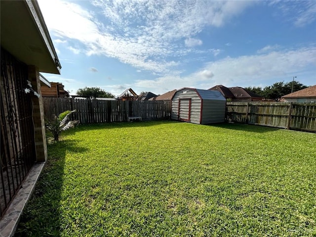 205 Msg Mario A Solis Ln, La Villa, TX 78562 - fenced backyard featuring a storage unit
