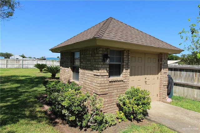 view of outdoor structure with a yard