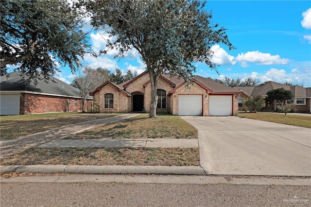 single story home with a garage and a front lawn