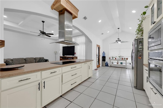 kitchen featuring ceiling fan, island exhaust hood, stainless steel appliances, and white cabinetry