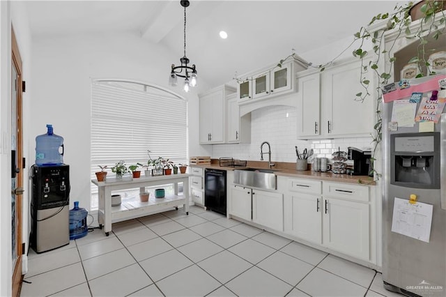 kitchen featuring stainless steel refrigerator with ice dispenser, sink, white cabinetry, dishwasher, and pendant lighting