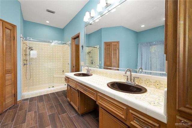 bathroom with vanity and walk in shower