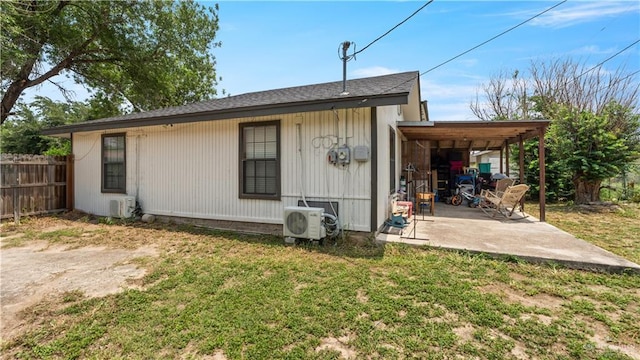 rear view of house with a patio area and ac unit