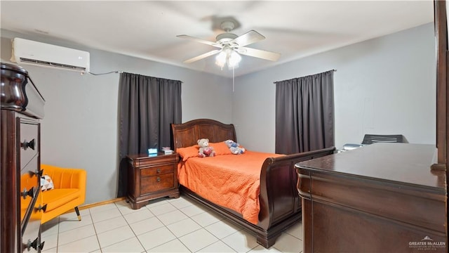 bedroom with a wall unit AC, ceiling fan, and light tile patterned floors