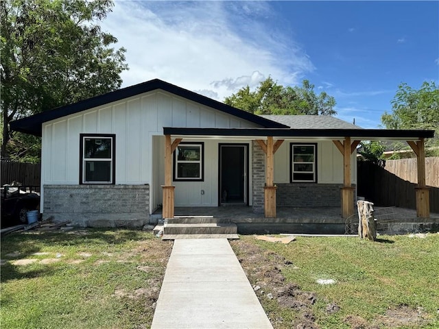 314 W Lincoln Ave, Harlingen, TX 78550 - view of front of property featuring covered porch and board and batten siding
