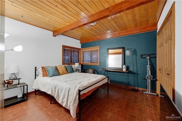 bedroom featuring dark wood-type flooring, a closet, and wooden ceiling