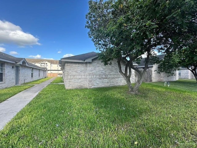 view of property exterior with a yard