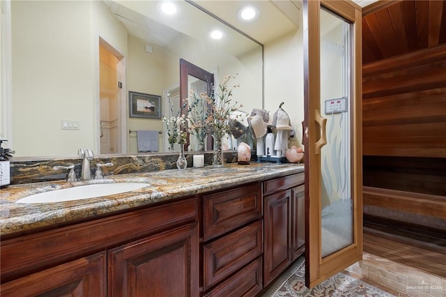 16408 Garrett Rd, Harlingen, TX 78552 - full bathroom featuring vanity, recessed lighting, a relaxing sauna, and wood walls