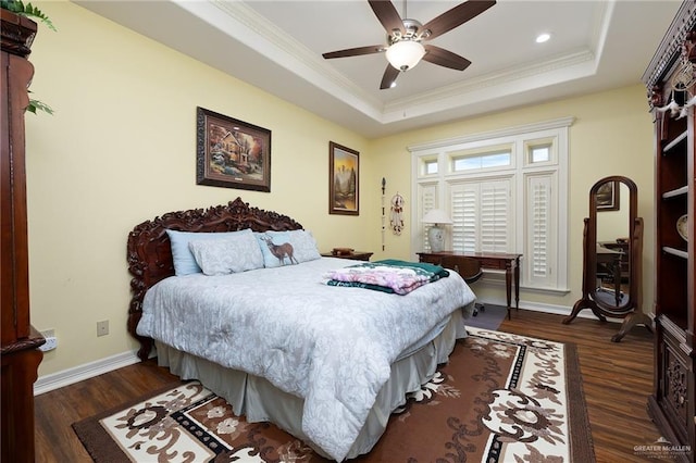 16408 Garrett Rd, Harlingen, TX 78552 - bedroom featuring dark wood-style flooring, ornamental molding, a tray ceiling, recessed lighting, and a ceiling fan