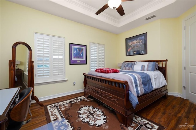 16408 Garrett Rd, Harlingen, TX 78552 - bedroom featuring wood finished floors, crown molding, a tray ceiling, and ceiling fan