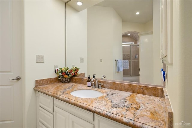 16408 Garrett Rd, Harlingen, TX 78552 - full bathroom with vanity, a shower with shower door, and recessed lighting