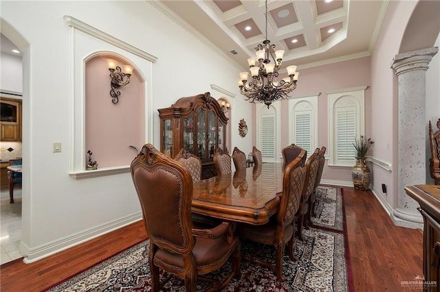 16408 Garrett Rd, Harlingen, TX 78552 - dining area featuring arched walkways, coffered ceiling, a chandelier, beam ceiling, and ornamental molding
