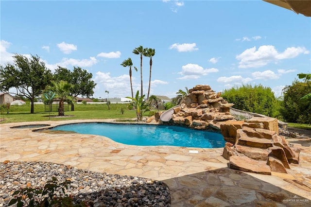 16408 Garrett Rd, Harlingen, TX 78552 - outdoor pool with a water slide, an in-ground hot tub, a patio area, and a lawn