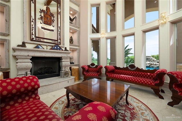 16408 Garrett Rd, Harlingen, TX 78552 - living room featuring plenty of natural light, a high ceiling, and a premium fireplace
