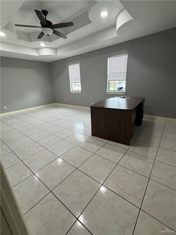 2110 Tiffany Dr, Mission, TX 78574 - unfurnished office with a tray ceiling, a ceiling fan, baseboards, recessed lighting, and light tile patterned flooring