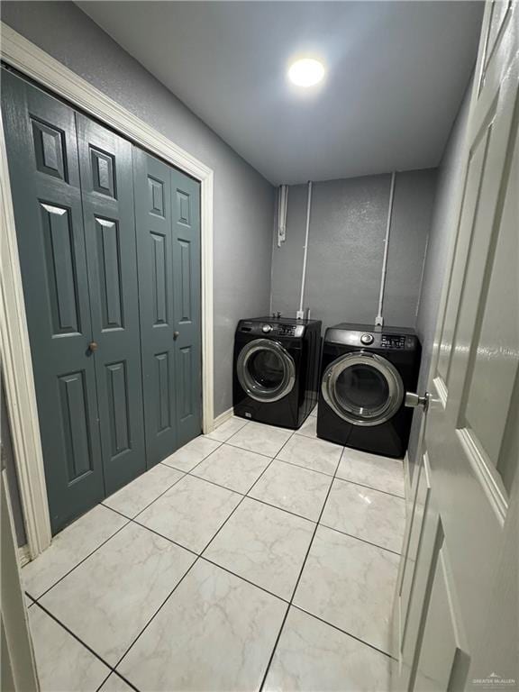 2110 Tiffany Dr, Mission, TX 78574 - washroom with washing machine and clothes dryer and tile patterned floors