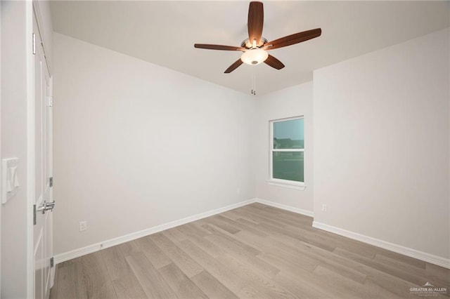 empty room featuring ceiling fan and light wood-type flooring