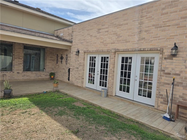 doorway to property featuring a patio area and french doors