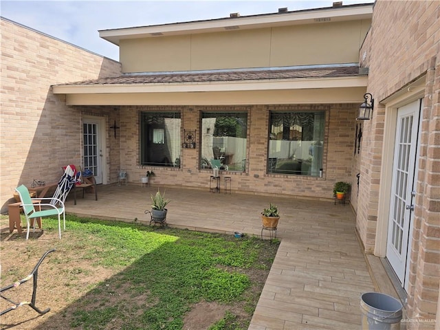 back of house with a yard and a patio area