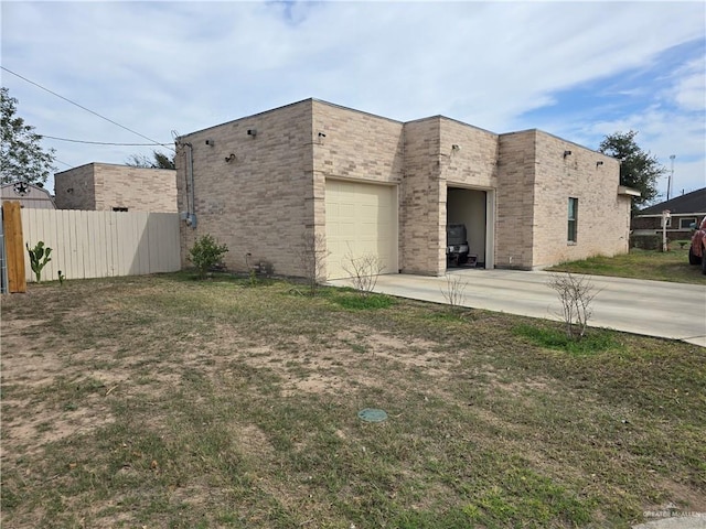 view of side of property with a garage and a yard