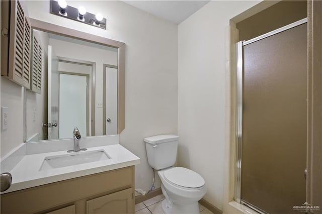 7013 N 14th Ln, Mcallen, TX 78504 - bathroom with tile patterned floors, baseboards, a sink, and double vanity