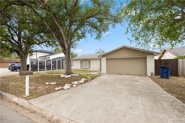 7013 N 14th Ln, Mcallen, TX 78504 - single story home with fence, an attached garage, driveway, and brick siding