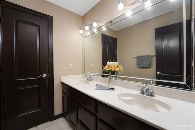 bathroom with tile patterned flooring and vanity