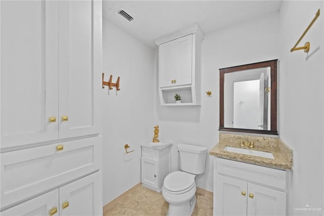 2005 E Bogey Dr, Mission, TX 78572 - bathroom with vanity, toilet, and baseboards