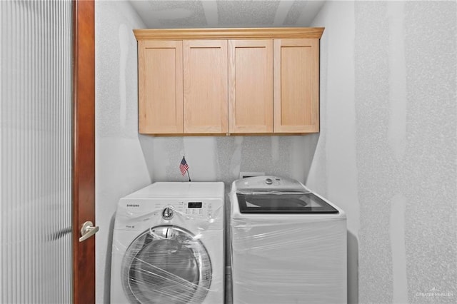 2005 E Bogey Dr, Mission, TX 78572 - washroom featuring independent washer and dryer and cabinet space