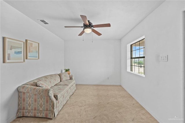 2005 E Bogey Dr, Mission, TX 78572 - living area with ceiling fan and baseboards