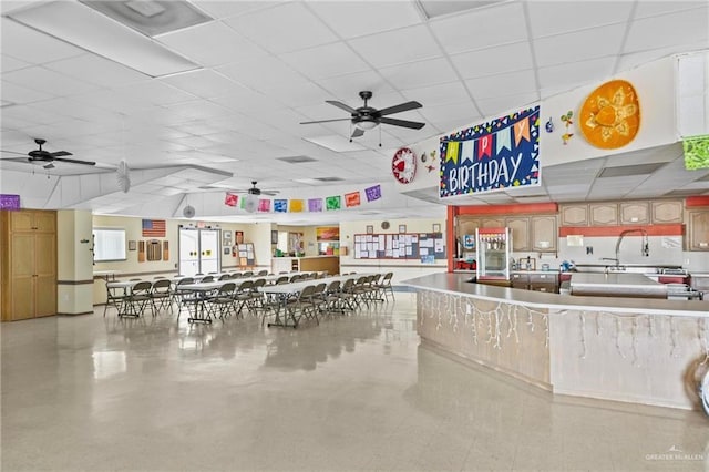 2005 E Bogey Dr, Mission, TX 78572 - miscellaneous room with a ceiling fan and a drop ceiling