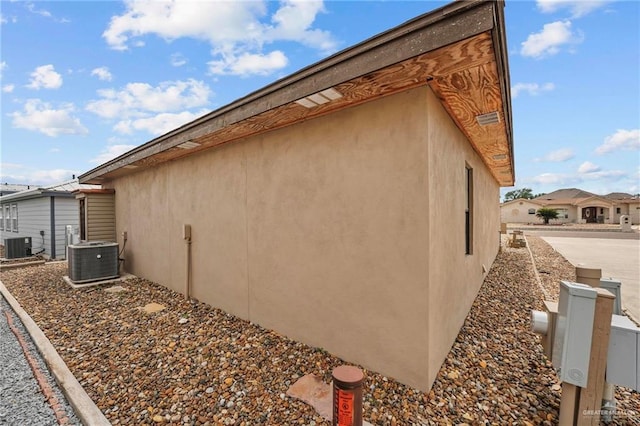 2005 E Bogey Dr, Mission, TX 78572 - view of home's exterior with central AC unit and stucco siding